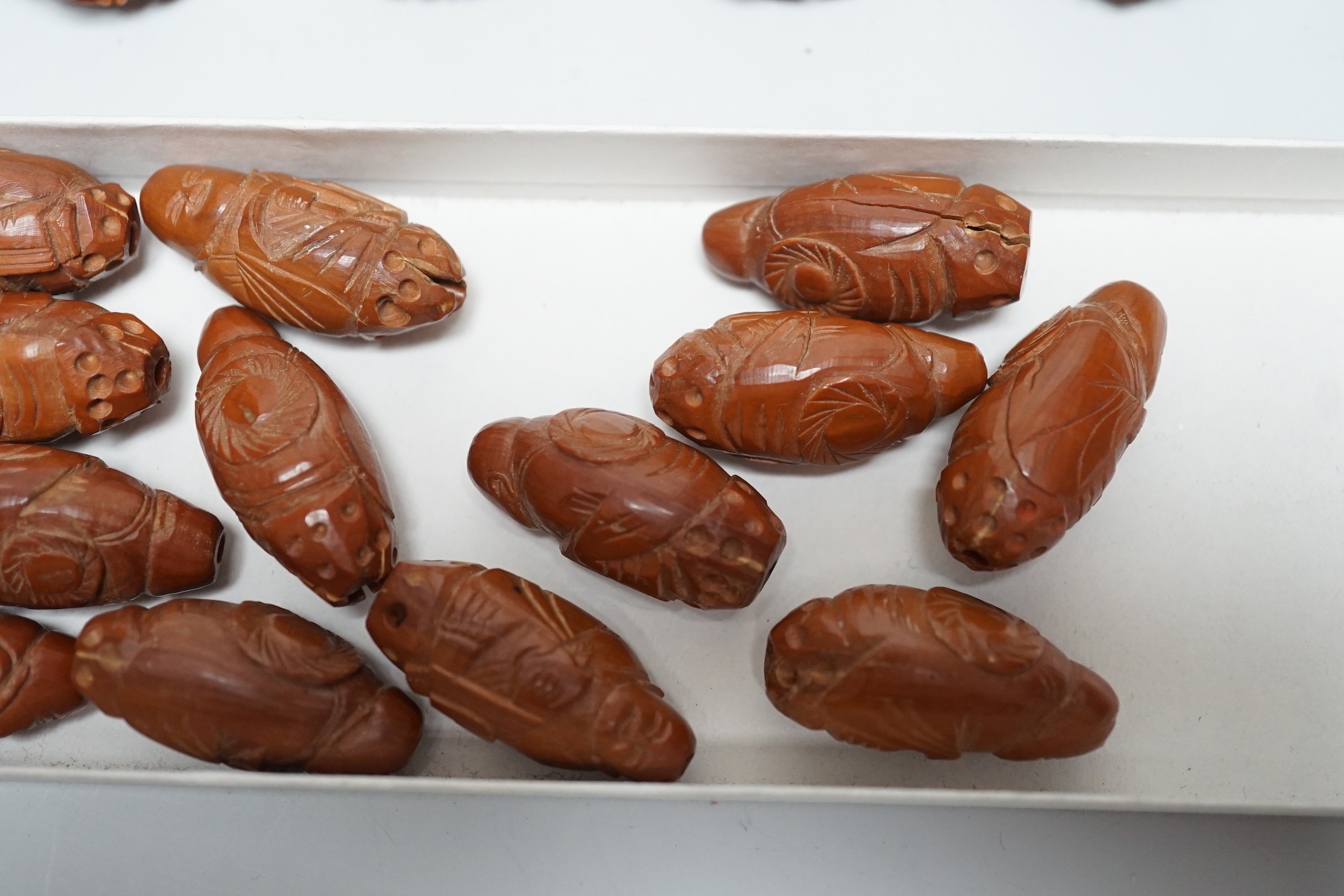 A collection of Chinese carved peach stones, early 20th century